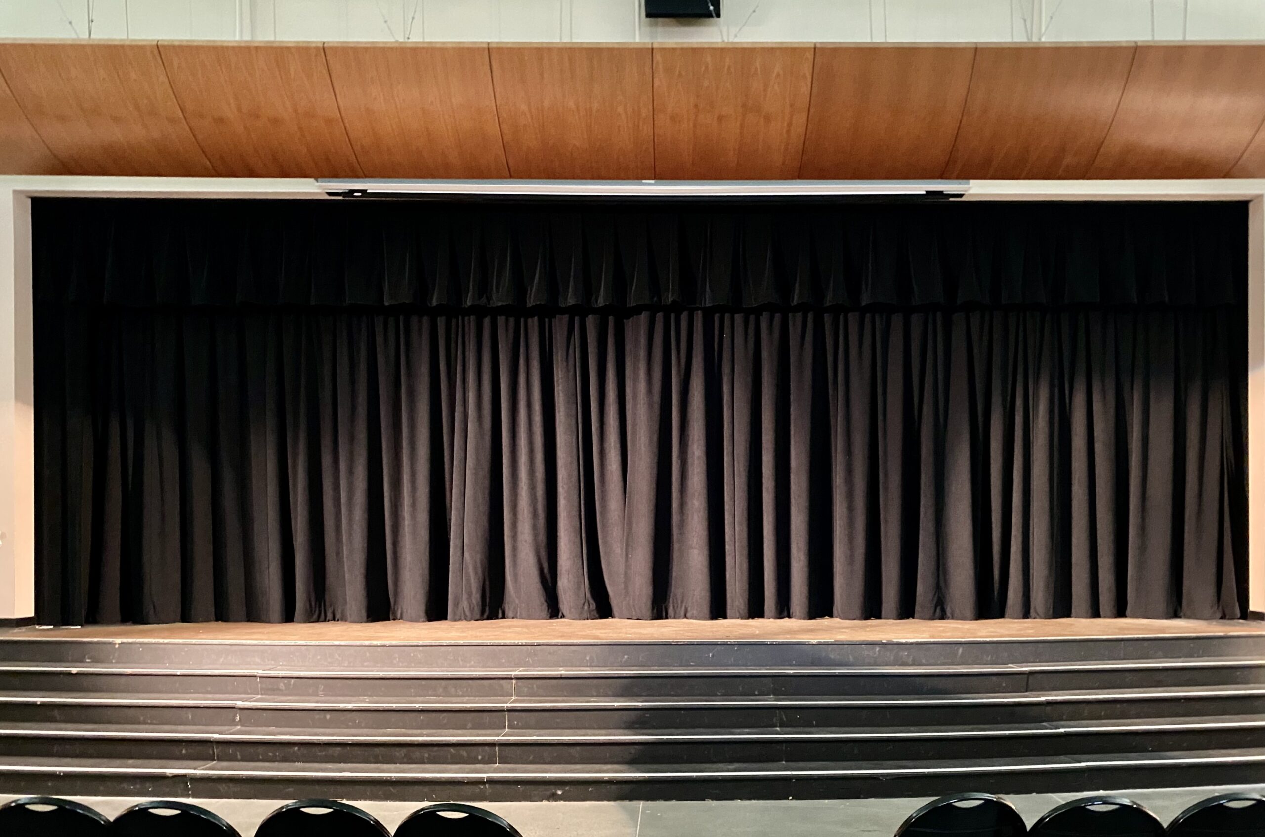 A stage with black curtains