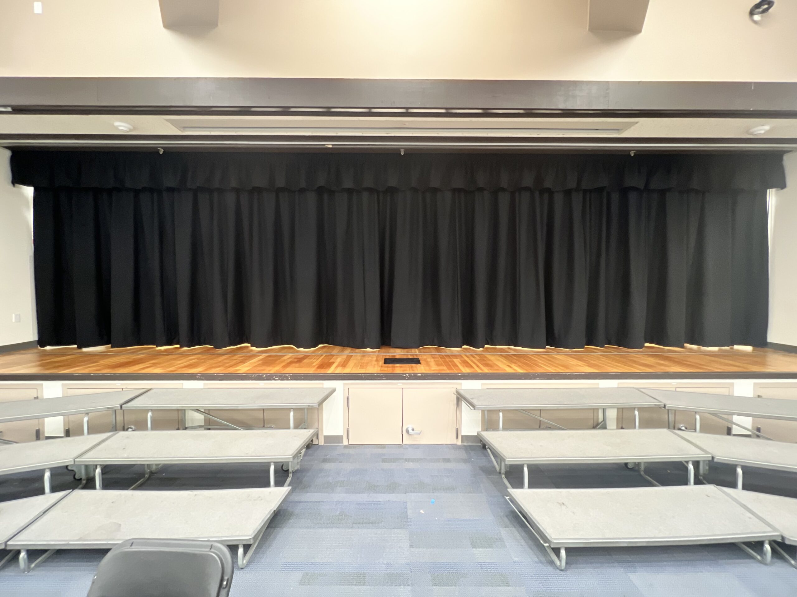 A stage with wooden flooring